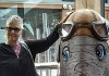 Mom posed with one of the elephant sculptures in the harbor that will be auctioned to raise money for elephants injured due to war.